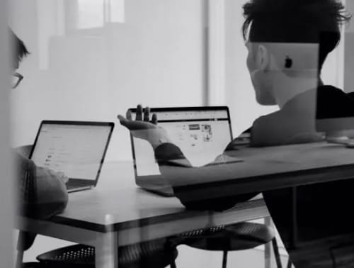 IT professionals collaborating during the early foundational years of Prudent.