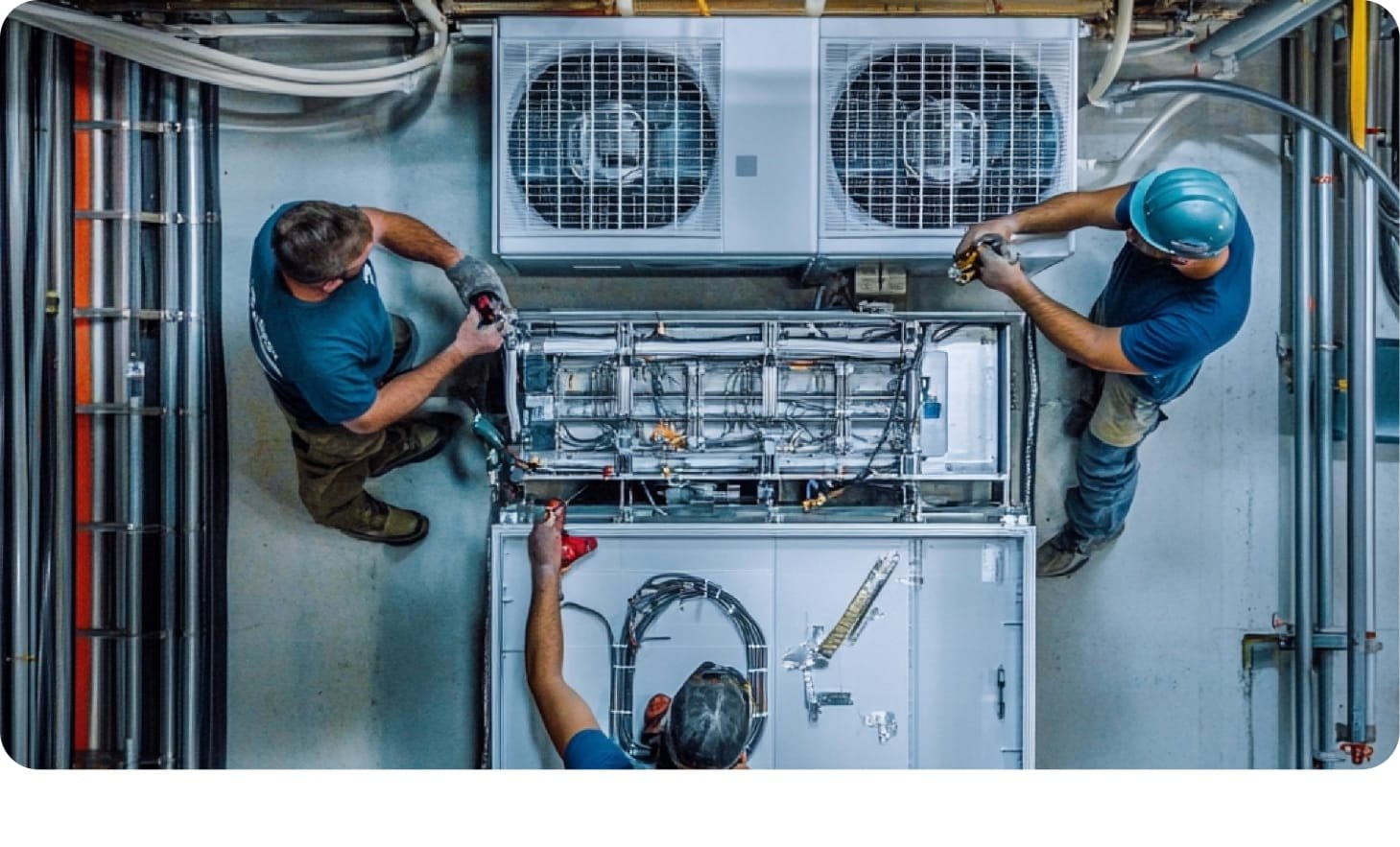 Technicians installing HVAC system for optimized enterprise operations.